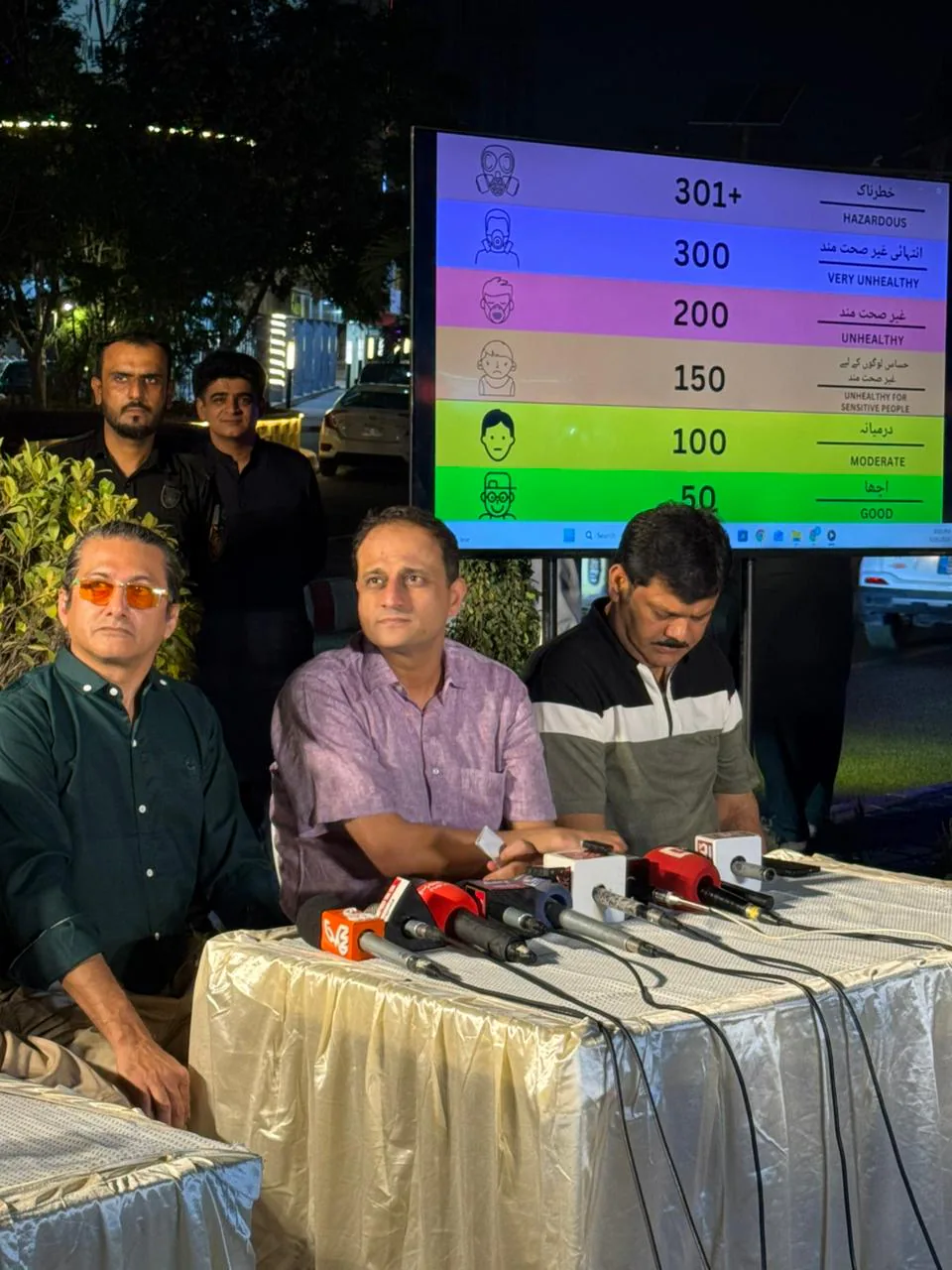 Citizen viewing colour-coded air-quality information in Karachi
